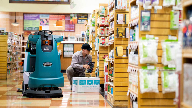 Employee restocking shelves