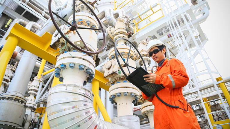 man working at refinery