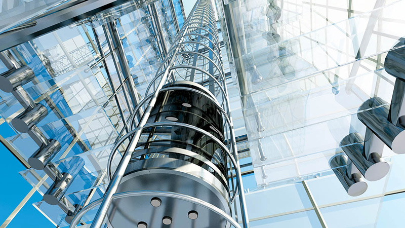 Cylindrical glass elevator in a modern high rise