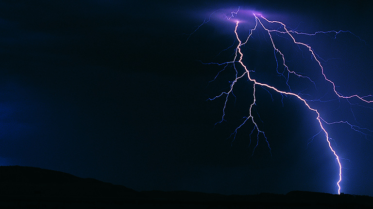 lightning across a dark blue sky