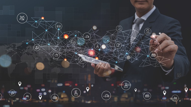 A person holding tablet and connecting supply chain related nodes