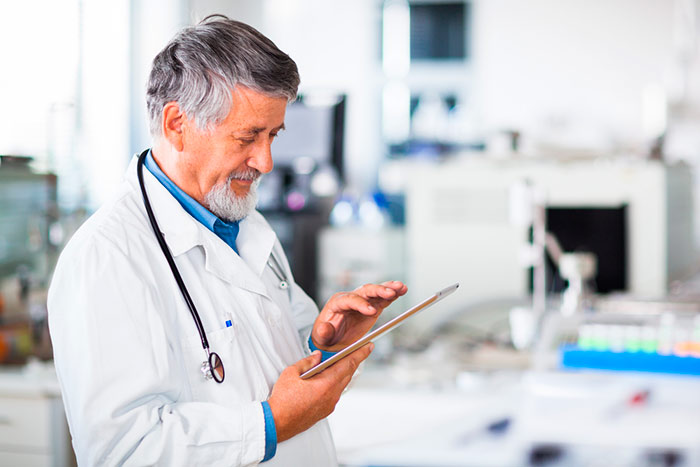 doctor using tablet computer doctor using tablet computer