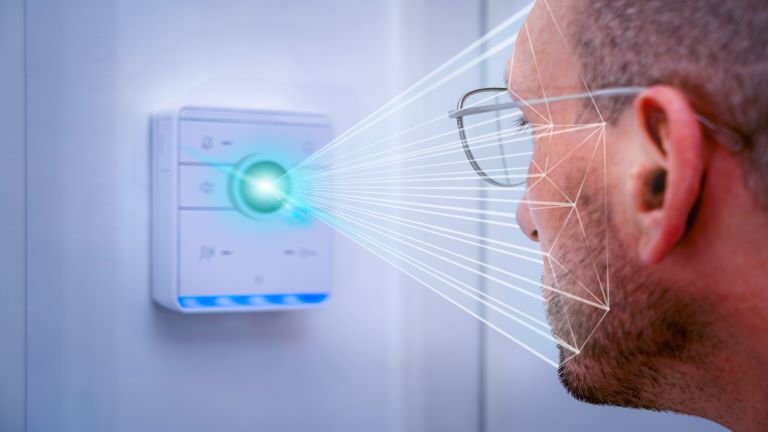 man looking into a sensor