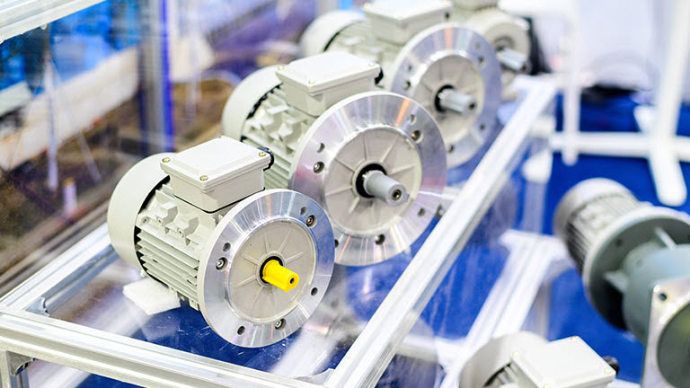 three electric motors on glass table