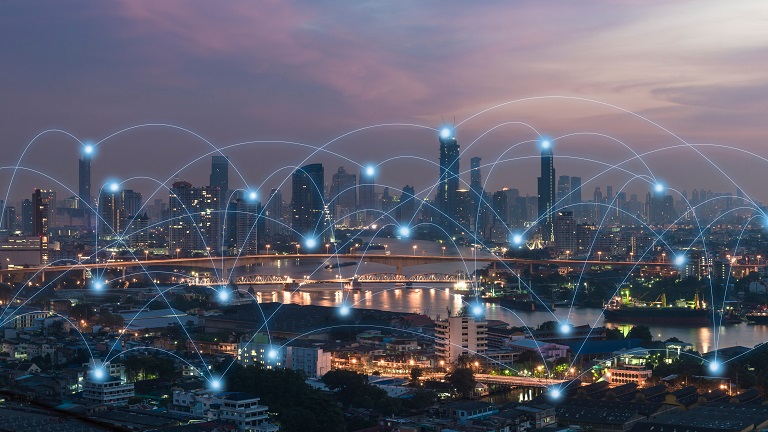 Illustration of IoT nodes over the city skyline